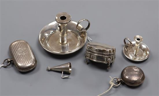 A silver combination stamp/sovereign case, another sovereign case, two miniature chambersticks and a patch box (a.f.)